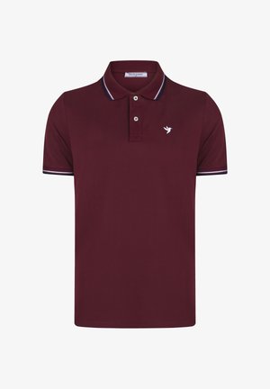 Polo bordeaux a manica corta con logo bianco di uccello sul petto, abbottonatura a due bottoni, colletto e bordi delle maniche a strisce bianche.