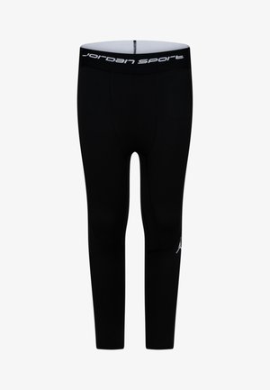 Juodos sportinės leginsai, prigludusio dizaino, minkštos medžiagos, su balta "Jordan Sport" logotipu ant juosmens ir šono.