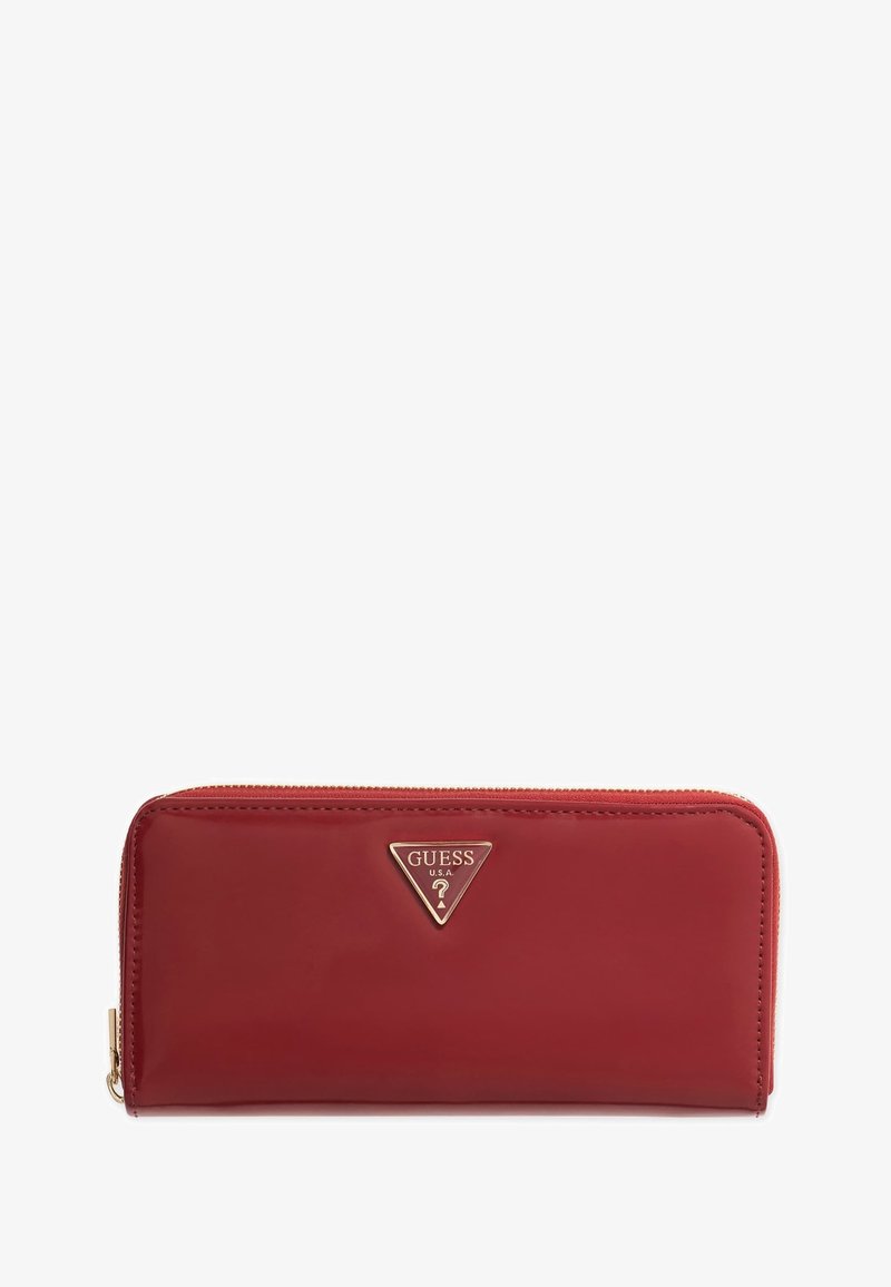 Red patent leather wallet with a triangular gold logo. Features a zip closure and sleek design, showcasing a smooth texture and finish.