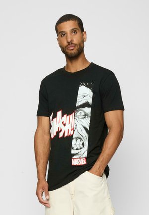 Black cotton t-shirt featuring a large graphic of an angry face and the word "SMASH!" in red text, with a white "MARVEL" logo at the bottom.