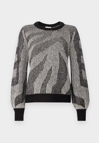 Svart och vit texturerad stickad tröja med ett geometriskt mönster, rundad halsringning och ribbade muddar och nederkant. Avslappnad passform med långa ärmar.