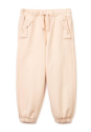 Jasnoróżowe spodnie dla małego dziecka z elastycznym pasem i ściągaczami przy nogawkach, dwie przednie kieszenie każda z detalem w postaci materiałowej kokardki.