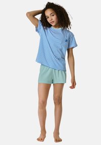 Blue and white striped short-sleeve t-shirt with a round neck and logo, paired with light green shorts, made from soft cotton fabric.