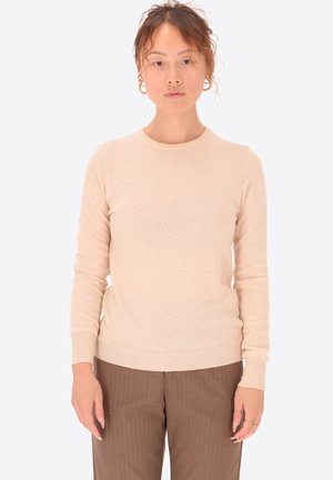Maglione beige chiaro con colletto a giro e maniche lunghe. Realizzato in un morbido tessuto testurizzato con polsini e orlo a coste.