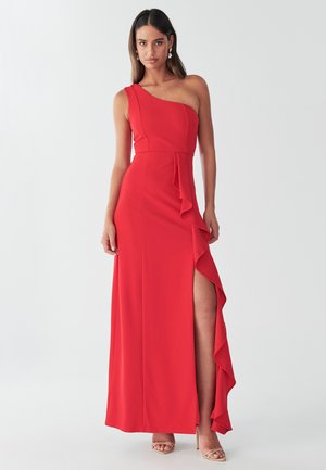 Red, one-shoulder maxi dress with ruffled accent and thigh-high slit. Made of smooth fabric, features a fitted bodice and flared skirt.