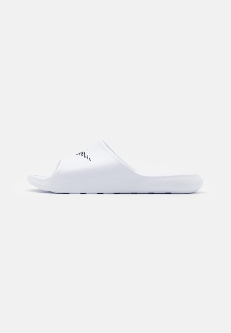 White slide sandals made of synthetic material, featuring an open toe, soft texture, and minimalistic design with a small logo detail.
