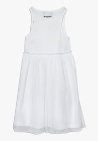 Biała sukienka bez rękawów z dopasowanym bawełnianym gorsetem i tiulową spódnicą, z elastycznym pasem i metką marki na plecach.