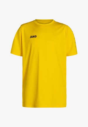 Gelbes Baumwoll-T-Shirt mit kurzen Ärmeln, runder Ausschnitt und schwarzem "JAKO"-Logo auf der linken Brust. Glatte Textur.