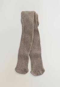 Ein Paar gefaltete, gerippte, beige-braune Wollstrumpfhosen flach auf einem hellen Hintergrund ausgelegt.