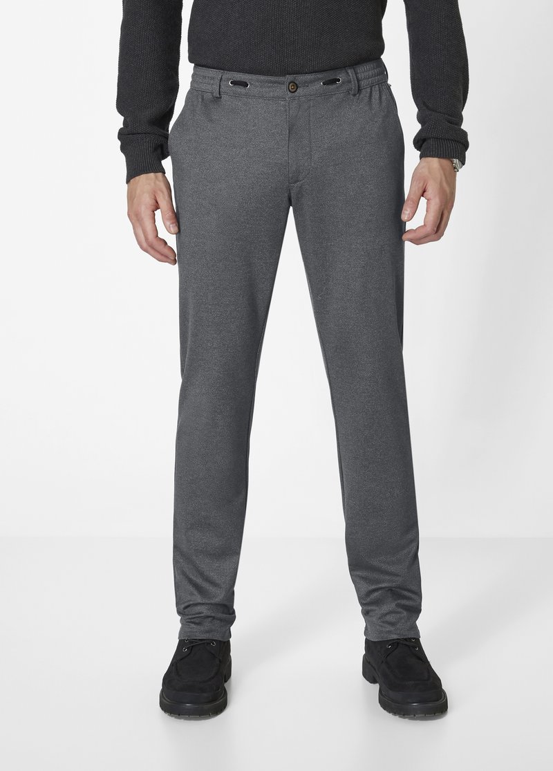 Gray tailored trousers with a smooth, textured fabric, featuring an elastic waistband with button closure, shown with black shoes.