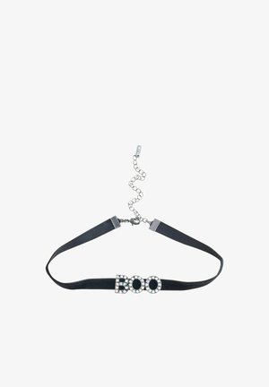 Black fabric choker adorned with the word "BOO" in silver-toned, studded letters; features adjustable chain for a customizable fit.