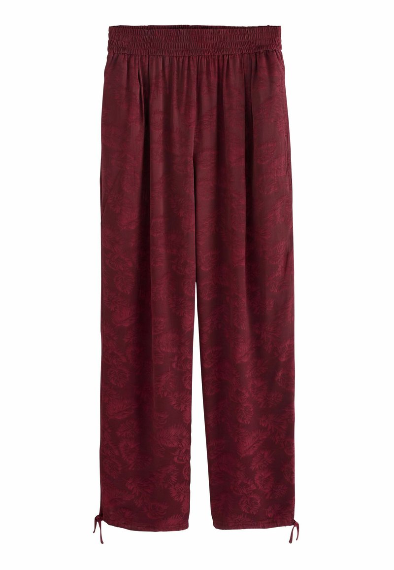 Bordeaux wijde broek met een elastische tailleband, voorzien van een subtiel bloemenpatroon en verstelbare koordjes bij de mouwen.