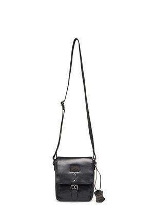 Black leather crossbody bag with adjustable strap, front buckle closure, and a leather tag hanging on the side.