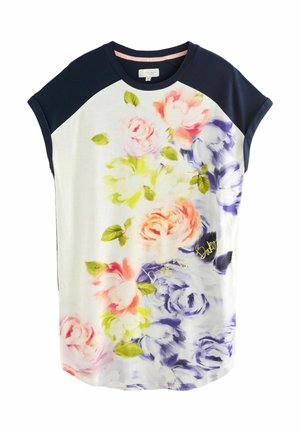 Top largo con motivo floreale e pannelli blu scuro sulle spalle. Presenta vivaci disegni di rose rosa, gialle e viola su uno sfondo chiaro.