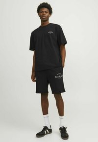 Jack & Jones PREMIUM Spodnji deli trenirk - schwarz