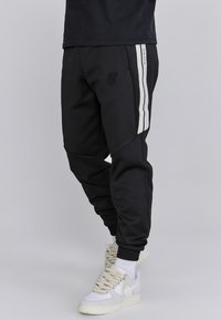 JOGGERS - Träningsbyxor - black