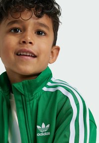 adidas Originals FIREBIRD UNISEX  - Verryttelyhousut - green