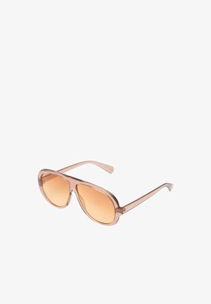 Lunettes de soleil aviateur transparentes marron clair avec verres dégradés ambre et branches fines.