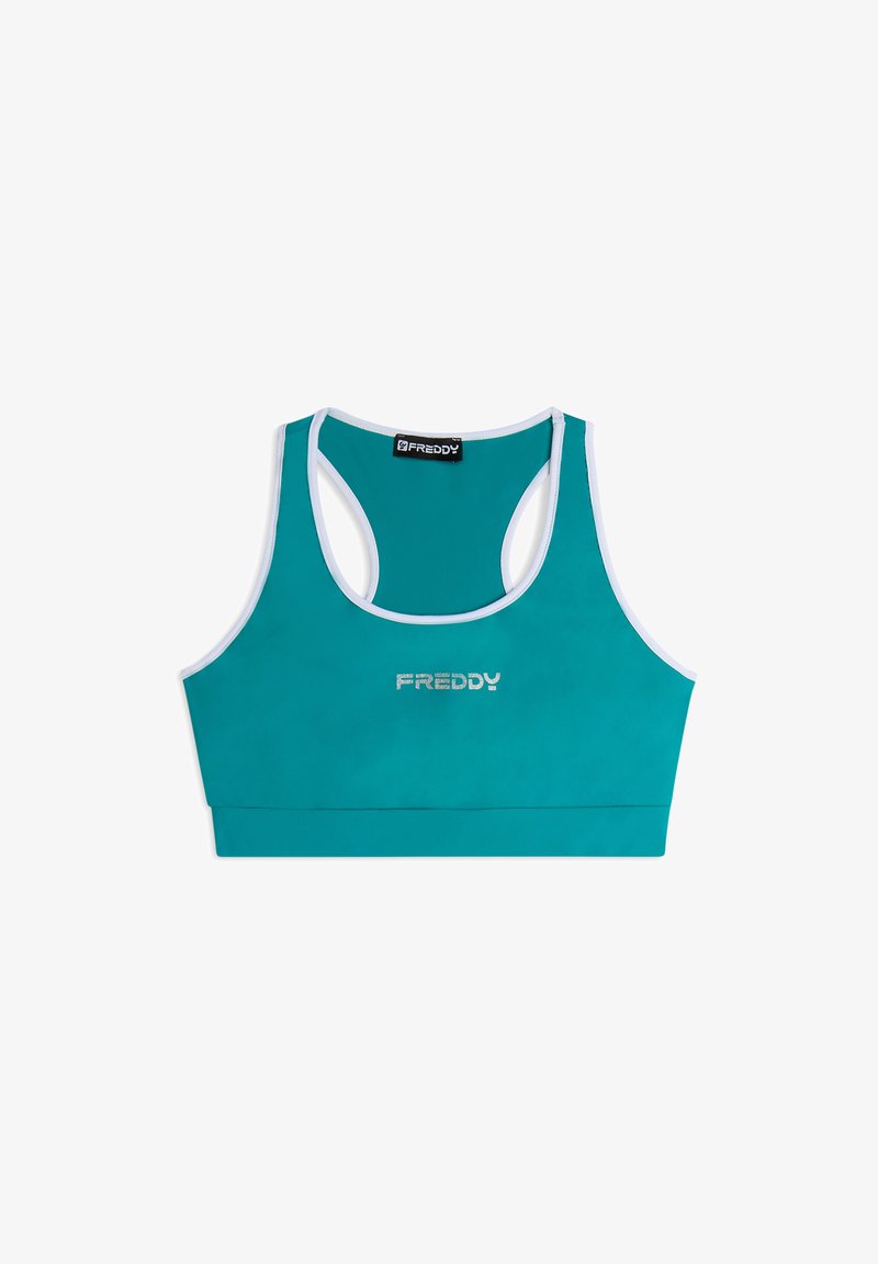 Soutien-gorge de sport teal avec un design dos nageur. Il présente des bordures blanches et un logo argenté "FREDDY" centré sur le devant. Matériel lisse et extensible.