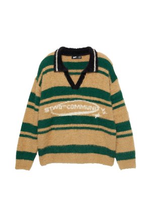 Nep od tkanine s tanimi in zelenimi črtami, z dlakavo teksturo, ovratnikom v obliki črke V in belim logotipom spredaj. Ima črno obrobo okoli ovratnika.