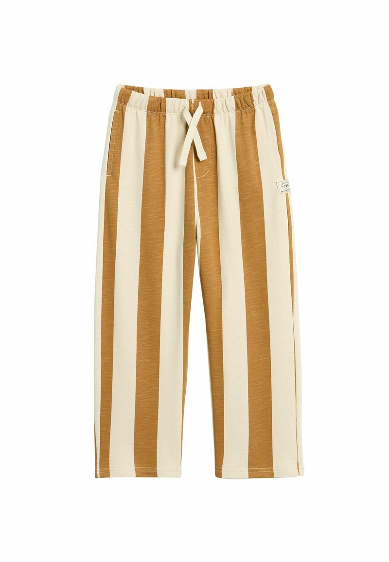 Lekki, w paski materiał spodni w odcieniach beżu i brązu. Posiada elastyczny pas, sznurek do regulacji i boczne kieszenie. Miękka tekstura i długość do kolan.