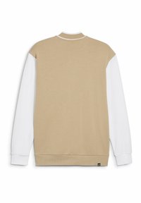 Felpa beige con maniche bianche, colletto e polsini a coste. Texture morbida con un dettaglio logo sul lato sinistro in basso.