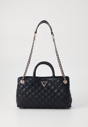 Black quilted leather handbag with top handles and a long chain strap, featuring a metal Guess logo on the front.