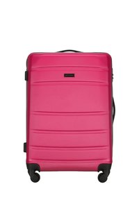 Pink hardshell suitcase with a textured surface, horizontal grooves, black accents, and four wheels for mobility. Brand logo is visible.