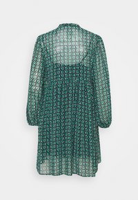 Long-sleeve dress in sheer fabric, featuring a dark green and navy floral pattern, with a gathered waist and high neckline.