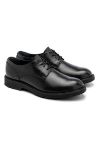 Scarpe in pelle nera con una finitura liscia, dotate di punta arrotondata, chiusura stringata e suole in gomma per una migliore trazione.