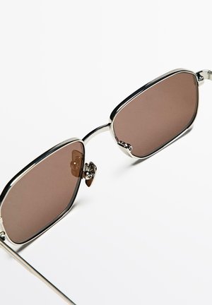 Metal-framed sunglasses with brown tinted lenses, rectangular shape, polished silver accents, and subtle nose pads for comfort.