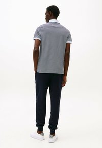 Tommy Hilfiger REGULAR - Polo - breezy blue   desert sky