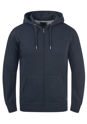 Marinblå dragkedjetröja i mjuk bomullsblandning, med snörning i huvan, två framfickor och ribbade ärmslut och nederkant.