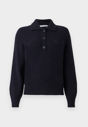 Navy knit pullover sweater with a buttoned collar, featuring long sleeves, ribbed hem and cuffs, and a small Lacoste logo on the chest.