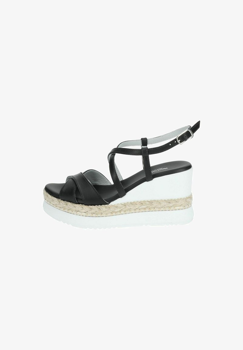 Black leather wedge sandals with cross straps. Features a white platform with a textured, woven jute layer and gold studs. Adjustable ankle strap.