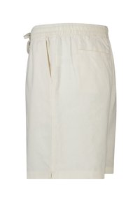 Shorts décontractés couleur blanc cassé avec ceinture élastique, poche latérale, poche passepoilée à l'arrière et cordon de serrage sur le côté gauche.