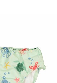 Gröna badbyxor med en volangmidja, med ett flerfärgat undervattensmönster av havsdjur och bubblor.
