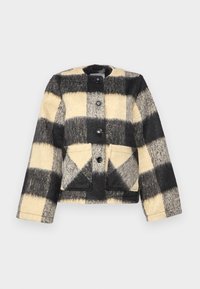 Veste en polaire avec un motif à carreaux noir et beige, dotée d'un col rond, de poches avant et d'une fermeture à boutons. Tissu texturé.