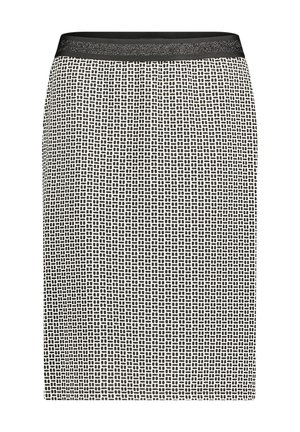 Jupe noire et blanche longueur genou avec un petit motif géométrique en tirets et une ceinture unie noire.