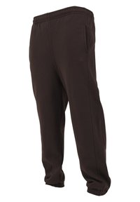 Pantaloni de trening maro, confecționați dintr-un material moale, având un elastic în talie, buzunare laterale și manșete elastice la glezne.