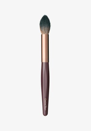 Makeup brush with a tapered, soft bristle head. Handle is burgundy with a metallic rose gold ferrule. Logo printed on the handle.