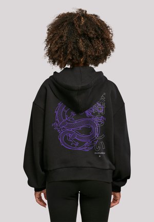 Black hoodie featuring a large purple dragon design on the back, with a loose fit and ribbed hem. Soft material, long sleeves.