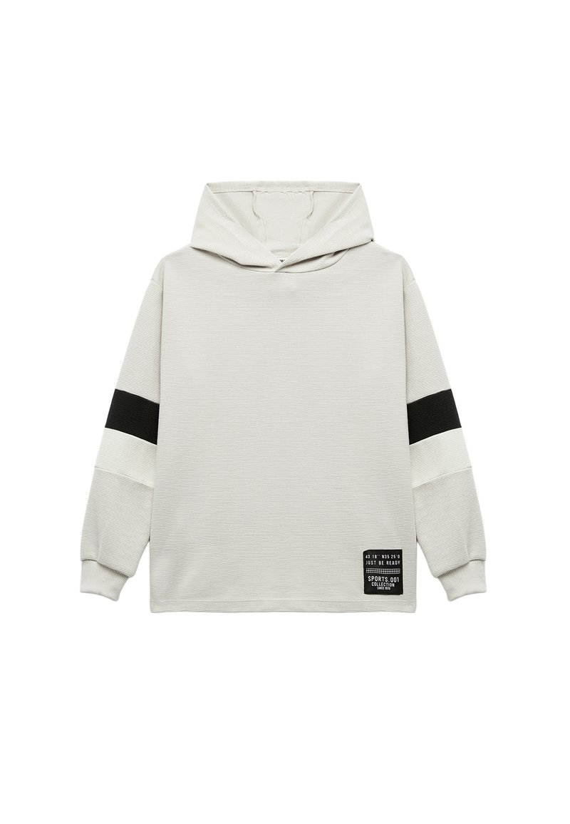 Lichtgrijze hoodie met zwart-witte gestreepte accenten. Ribbelstructuur en applicélabel aan de onderzijde. Ontspannen pasvorm.