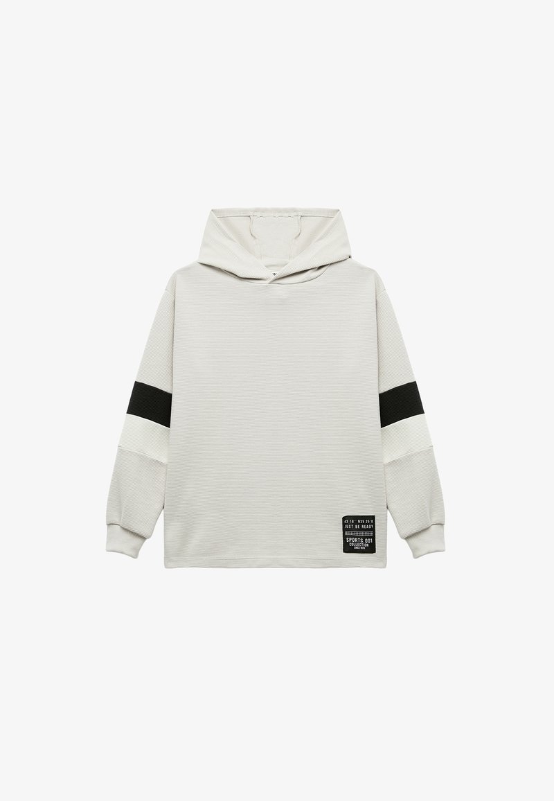 Lichtgrijze hoodie met zwart-witte gestreepte accenten. Ribbelstructuur en applicélabel aan de onderzijde. Ontspannen pasvorm.