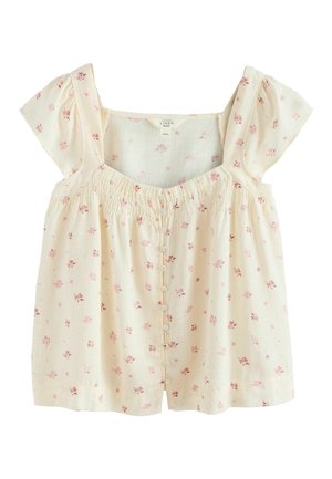 Krémová halenka s růžovým květinovým vzorem, krátkými volánkovými rukávy, nařaseným čtvercovým výstřihem a zapínáním na knoflíky vpředu.