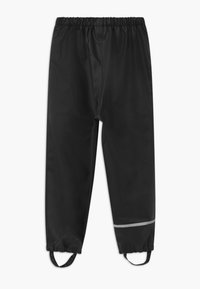 Black waterproof pants with an elastic waist, reflective strip at the lower leg, and adjustable foot straps for secure fit. Smooth texture.