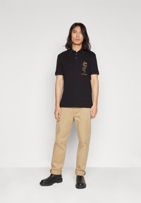Armani Exchange Polo shirt - black