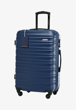 Tmavě modrý hard shell kufr s vertikálním žebrováním, s vysunovací rukojetí, horní rukojetí a čtyřmi kolečky s více směry. Připojená značka.