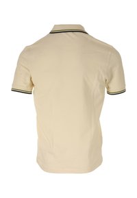 Polo beige à coupe slim, avec un col classique et des manches courtes. Accentué de bordures rayées vert foncé et noires.