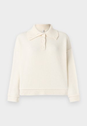 Pulover svijetlosmeđe boje s rebrastim ovratnikom i donjim rubom, koji ima dugmad u henley stilu i široke rukave.